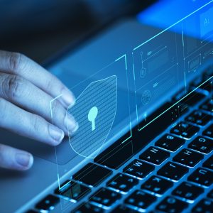 Woman scrolling on a laptop